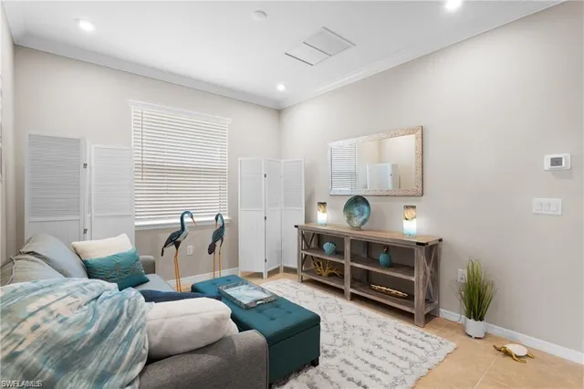 a living room with furniture a rug and a wooden floor