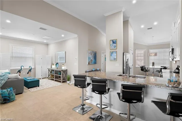 a living room with lots of furniture and sitting area