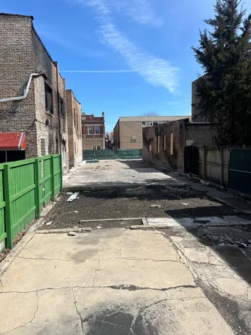 a view of a street with a building in the background
