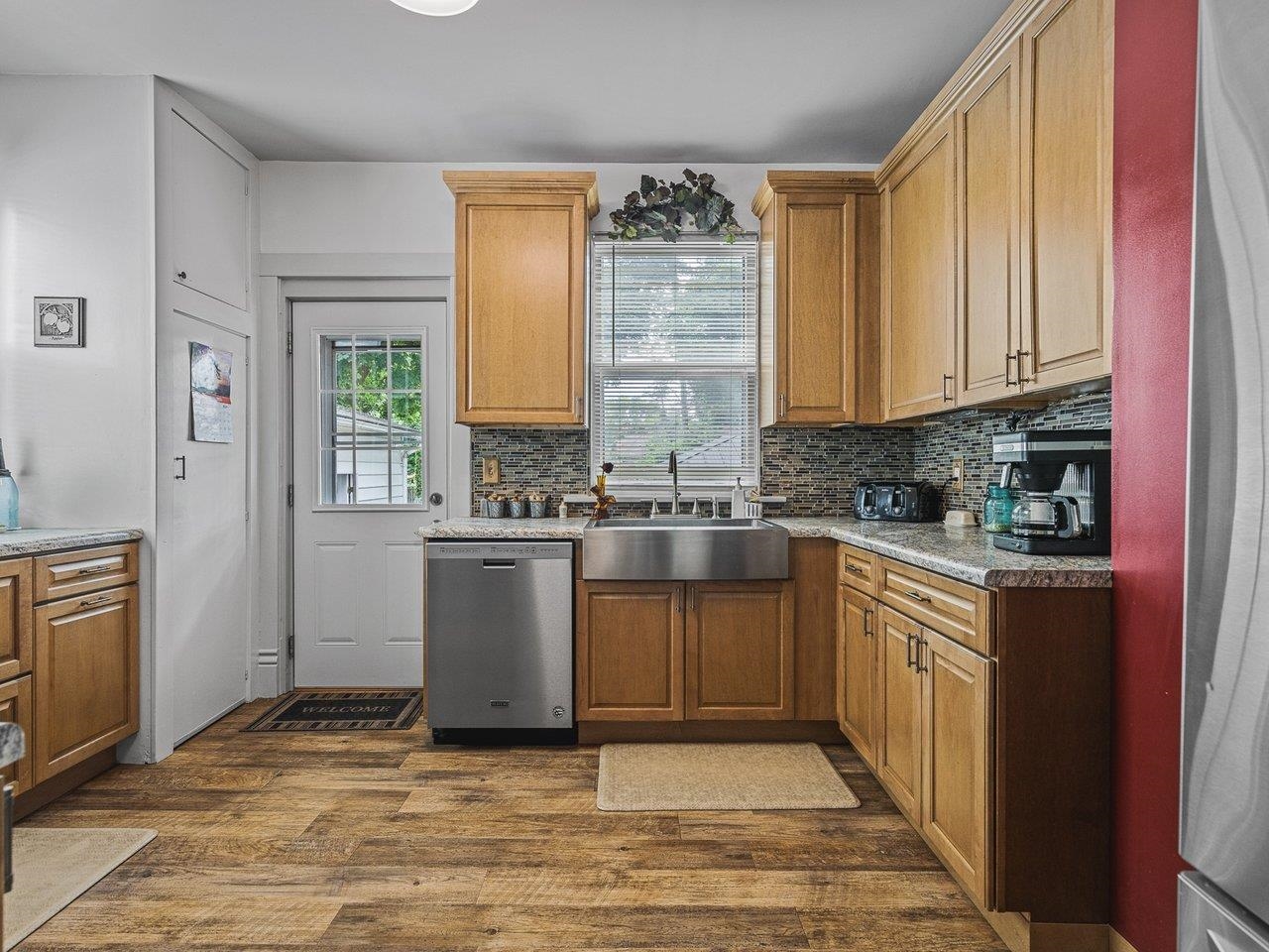 250 Edward Street Sycamore, IL 60178 - Photo 12 of 31 a kitchen with stainless steel appliances granite countertop a stove a sink and a refrigerator