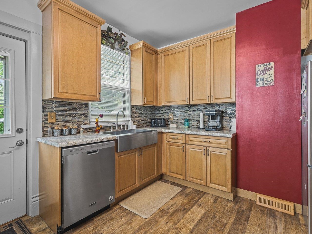 250 Edward Street Sycamore, IL 60178 - Photo 13 of 31 a kitchen with stainless steel appliances granite countertop a sink and cabinets