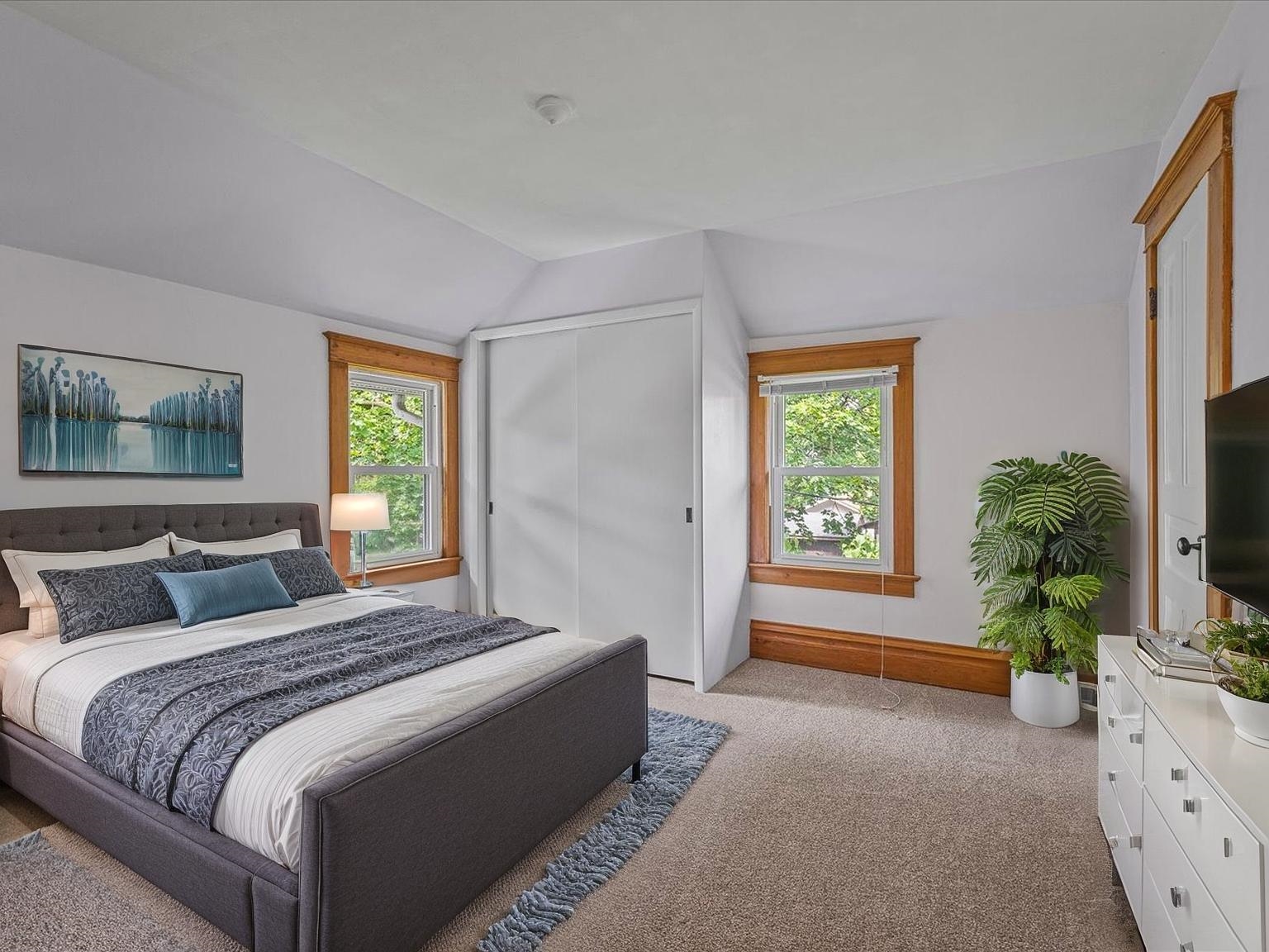 250 Edward Street Sycamore, IL 60178 - Photo 18 of 31 a bedroom with a bed and a flat screen tv