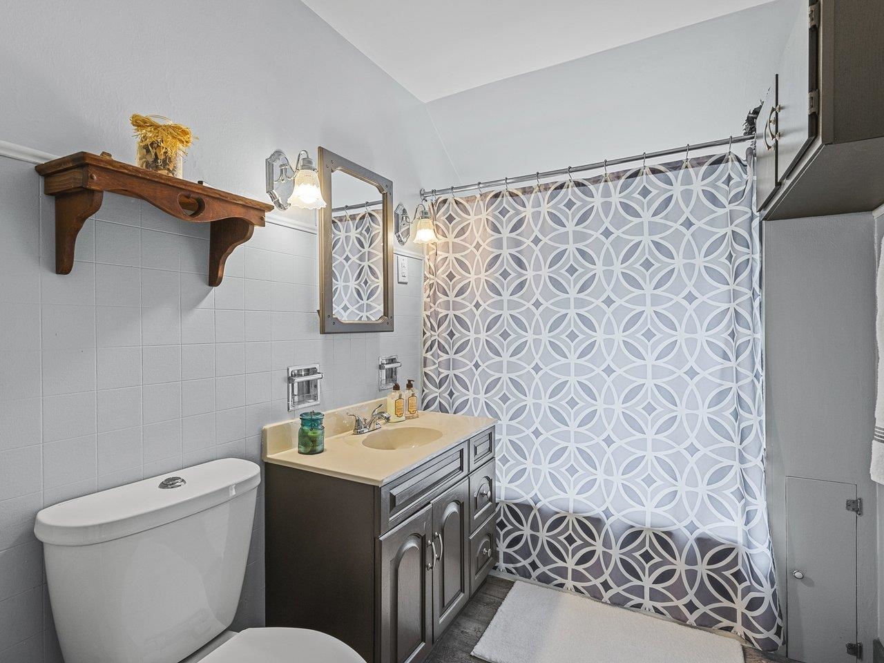 250 Edward Street Sycamore, IL 60178 - Photo 21 of 31 a bathroom with a granite countertop sink and a toilet