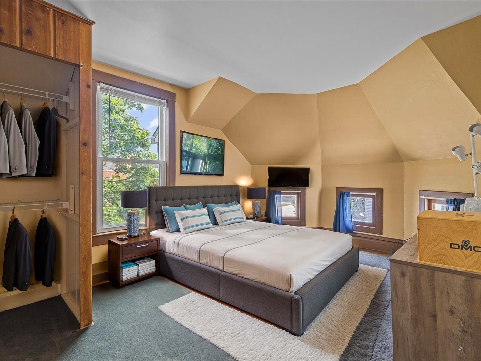 250 Edward Street Sycamore, IL 60178 - Photo 22 of 31 a bedroom with a bed a fireplace and a large window