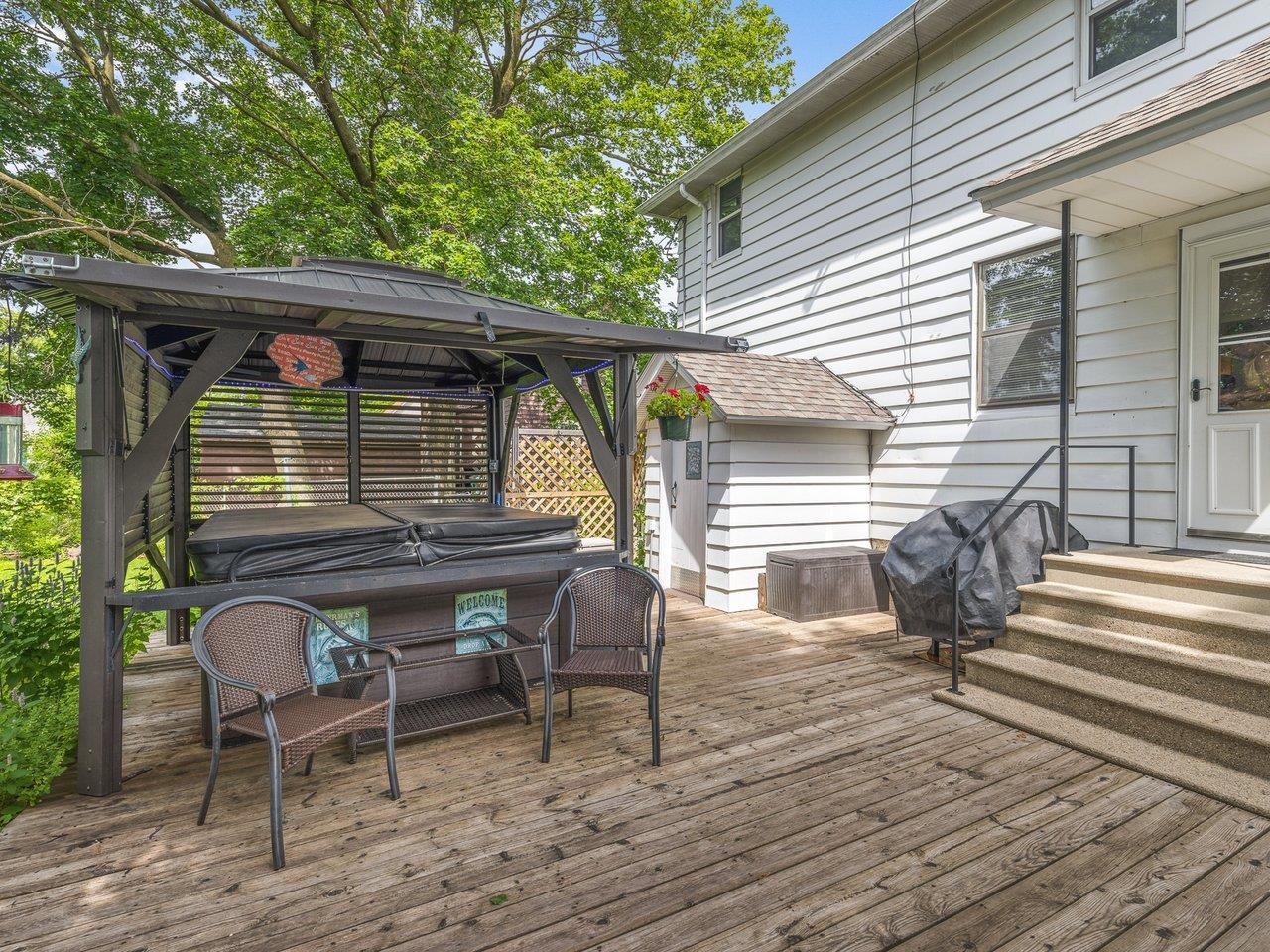 250 Edward Street Sycamore, IL 60178 - Photo 25 of 31 a front view of house with deck outdoor seating space and yard