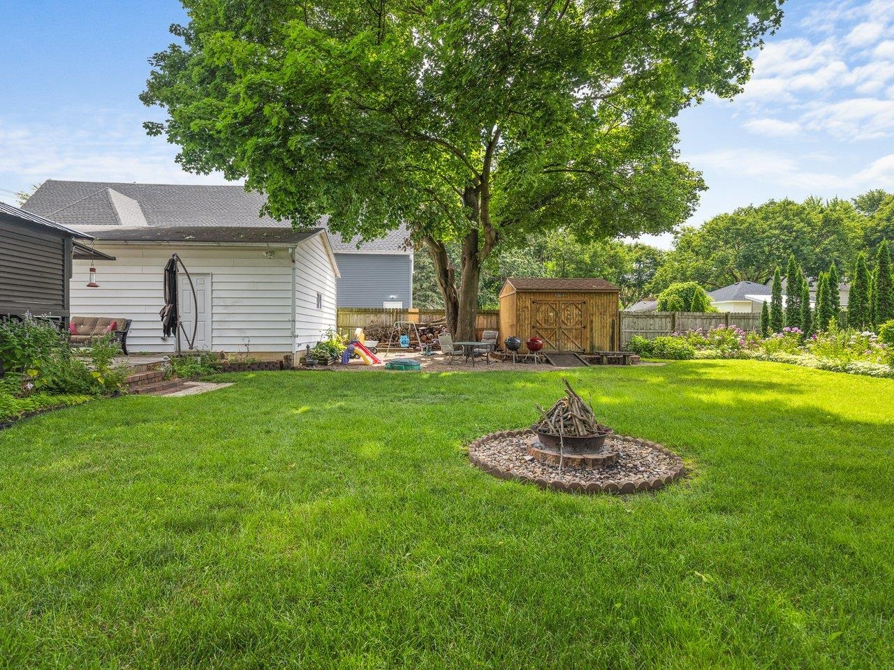 250 Edward Street Sycamore, IL 60178 - Photo 30 of 31 a front view of a house with a yard table and seating