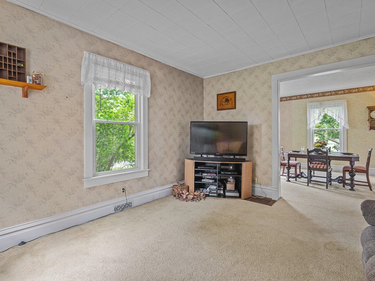 250 Edward Street Sycamore, IL 60178 - Photo 10 of 31 a view of a livingroom with furniture and a flat screen tv