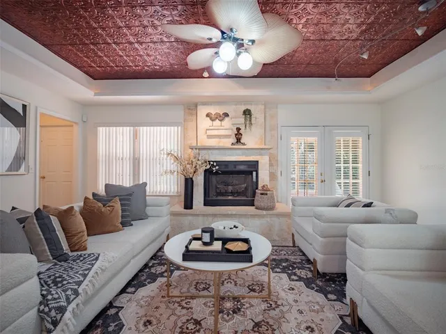 a living room with furniture and a fireplace