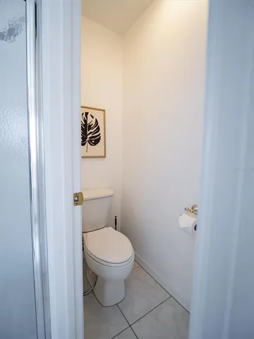 a view of a hallway with wooden shelves