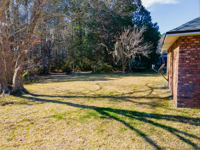 a backyard of a house with lots of green space