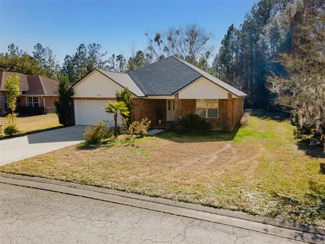 a house with trees in the background