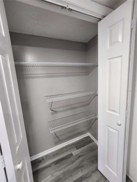 5541 Bay Boulevard, Unit 403 Port Richey, FL 34668 - Photo 10 of 24 a refrigerator in a kitchen