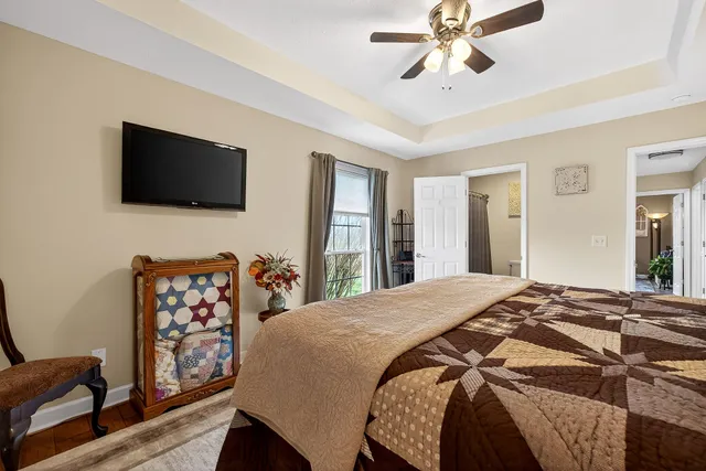 a view of a house with a patio and a yard