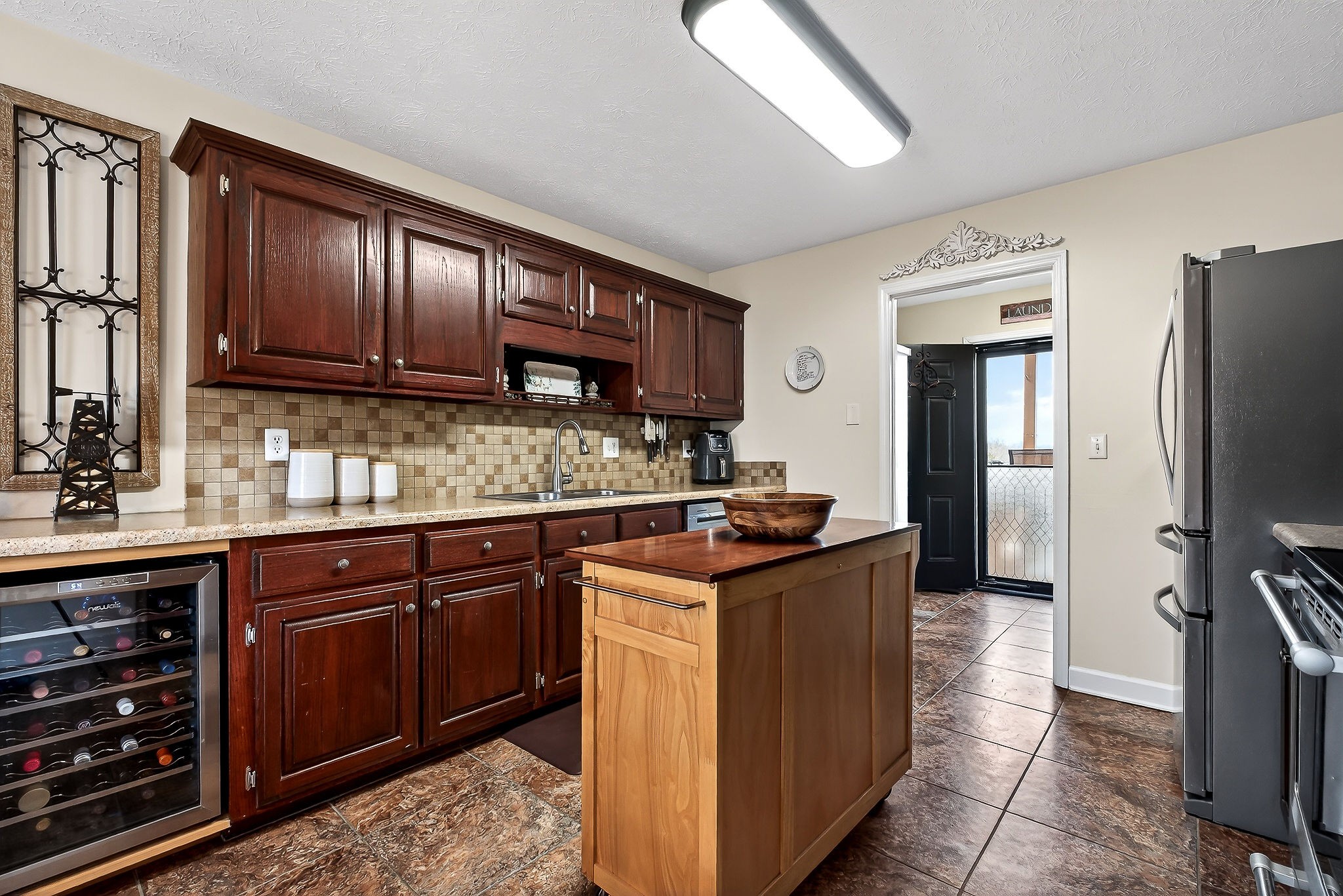 1445 Tom Grissom Road Morrison, TN 37357 - Photo 8 of 42 a kitchen with stainless steel appliances granite countertop a stove a refrigerator and a sink