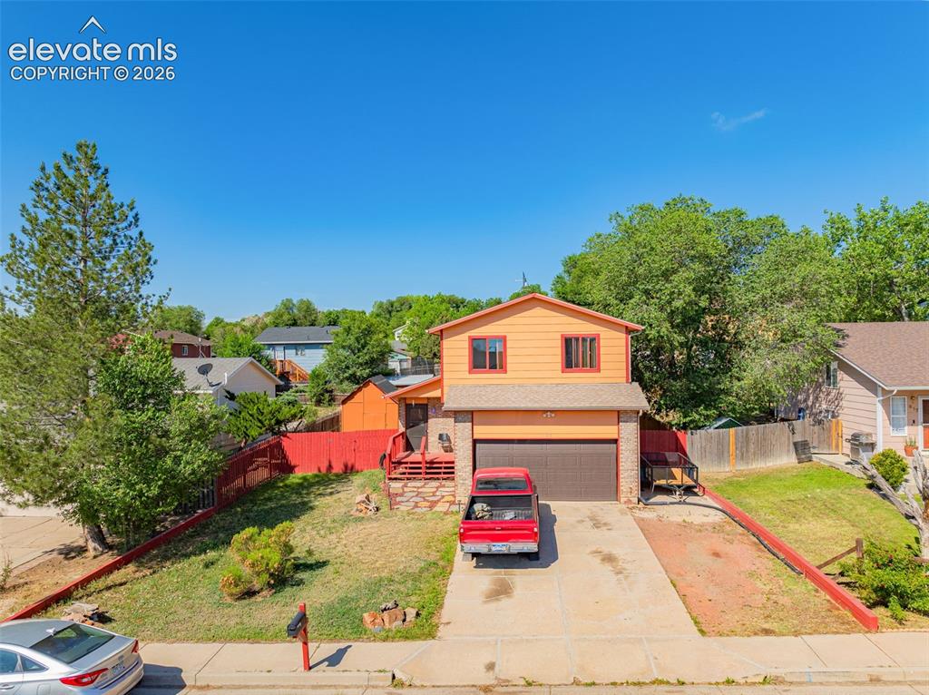 613 Wheat Field Road Fountain, CO 80817 - Photo 2 of 32 a front view of a house with a yard