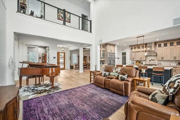 a room with stainless steel appliances granite countertop a stove and refrigerator
