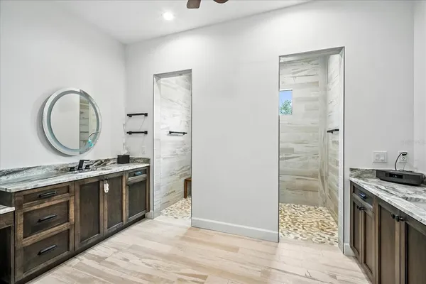 a bathroom with a toilet and a shower