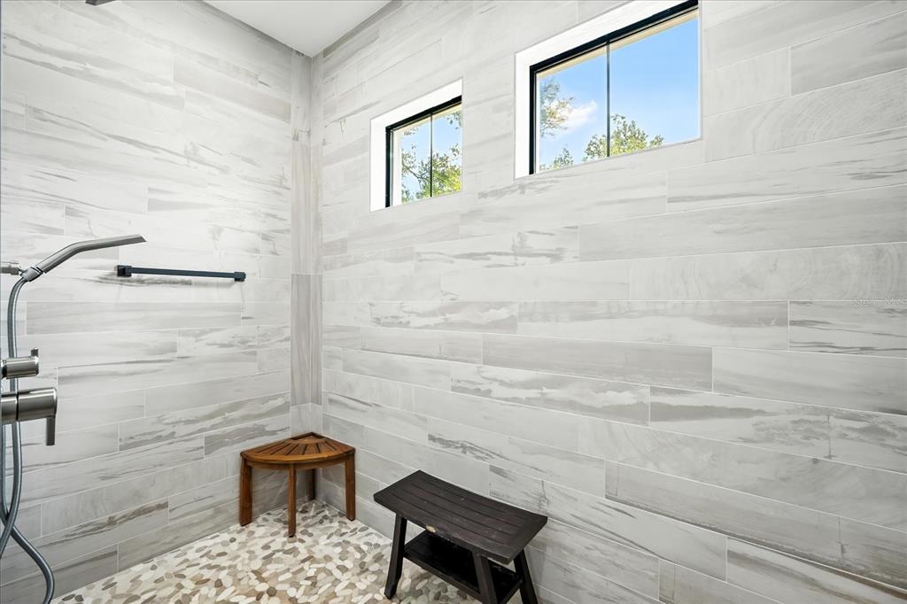 8317 Alafia Pointe Drive Riverview, FL 33578 - Photo 24 of 47 a bathroom with a toilet and a shower