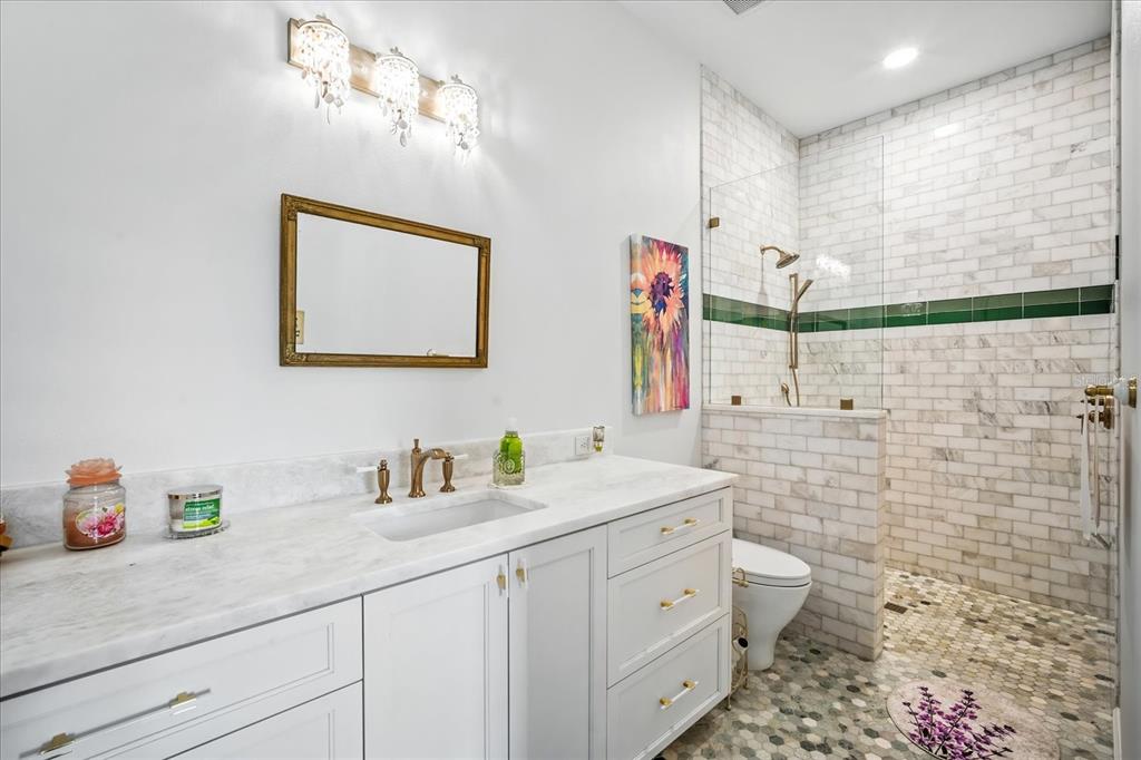 8317 Alafia Pointe Drive Riverview, FL 33578 - Photo 27 of 47 a bathroom with a double vanity sink mirror and toilet