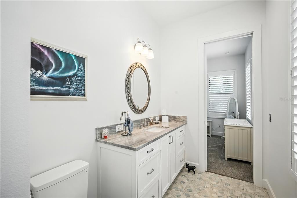 8317 Alafia Pointe Drive Riverview, FL 33578 - Photo 31 of 47 a bathroom with a toilet a sink and a mirror