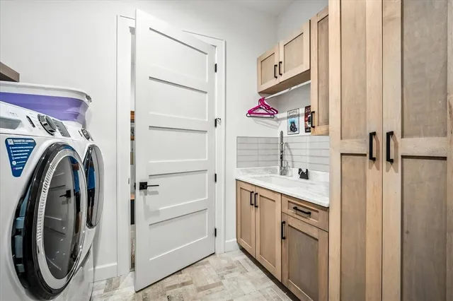 a kitchen with a table chairs stove and cabinets