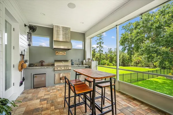 a room with furniture and a large window