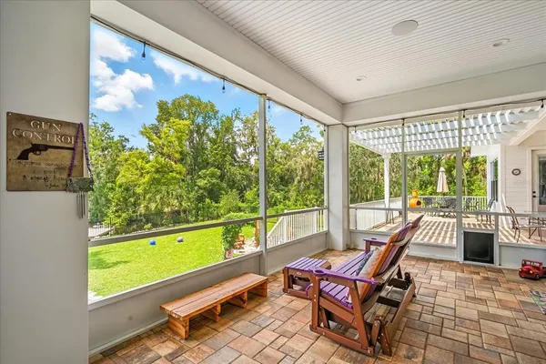a balcony with furniture and potted plants
