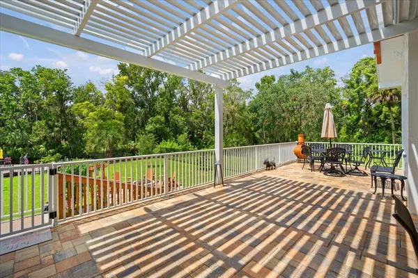 a view of a chairs and table in the garden