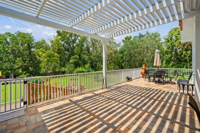 a view of a chairs and table in the garden