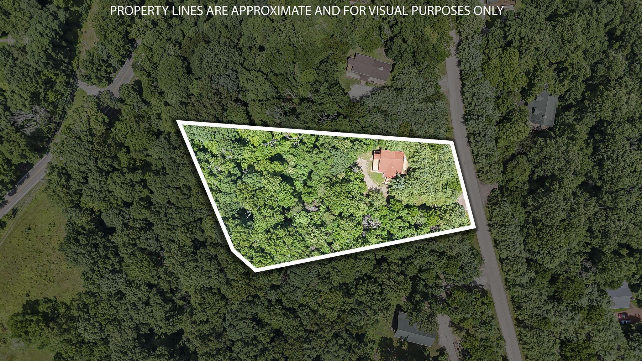 19475 Linden Road Logan, OH 43138 - Photo 81 of 94 Wooded lot featuring a single-story residence with a red-toned roof