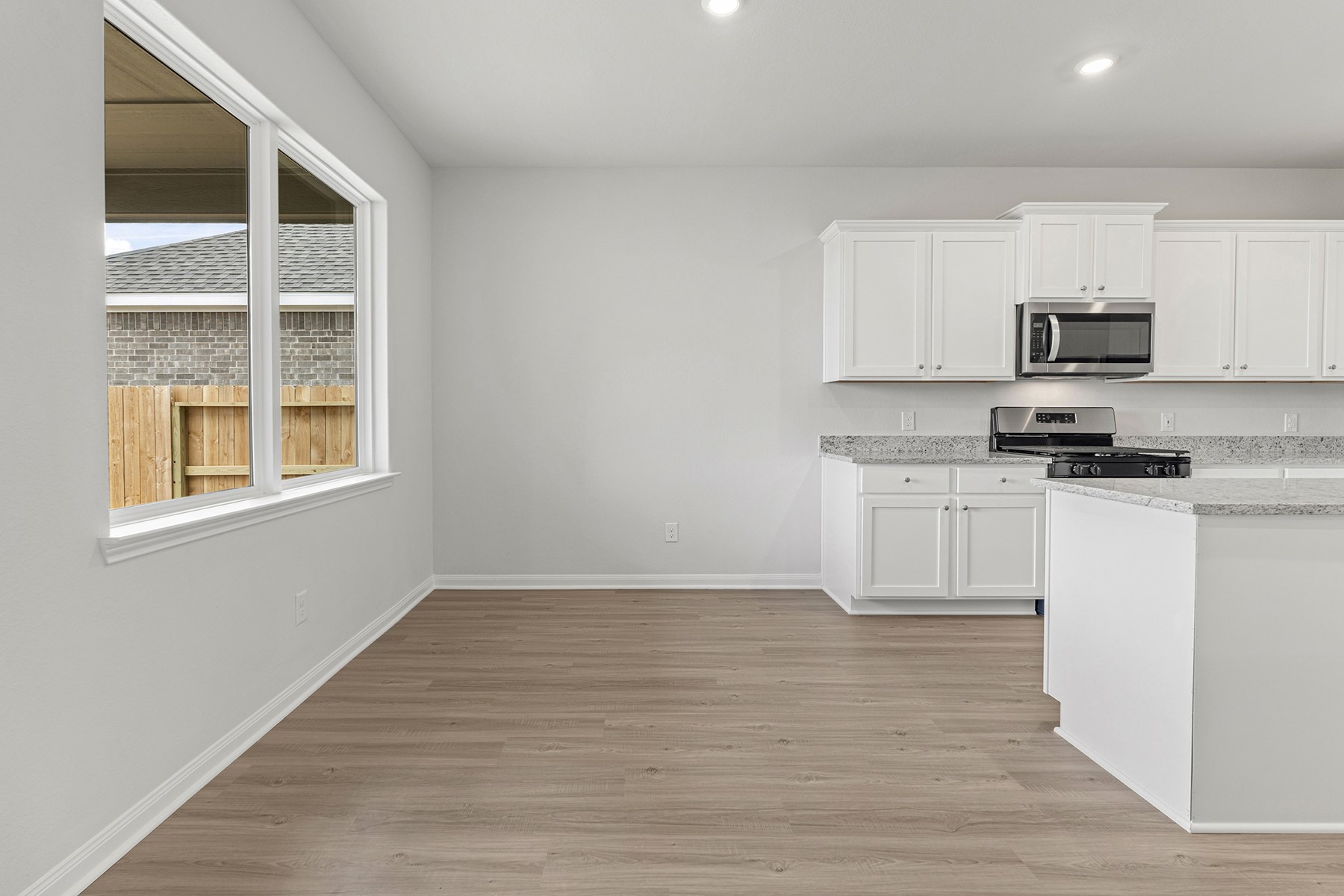1131 Campside Drive Beasley, TX 77417 - Photo 8 of 15 a kitchen with white cabinets and appliances