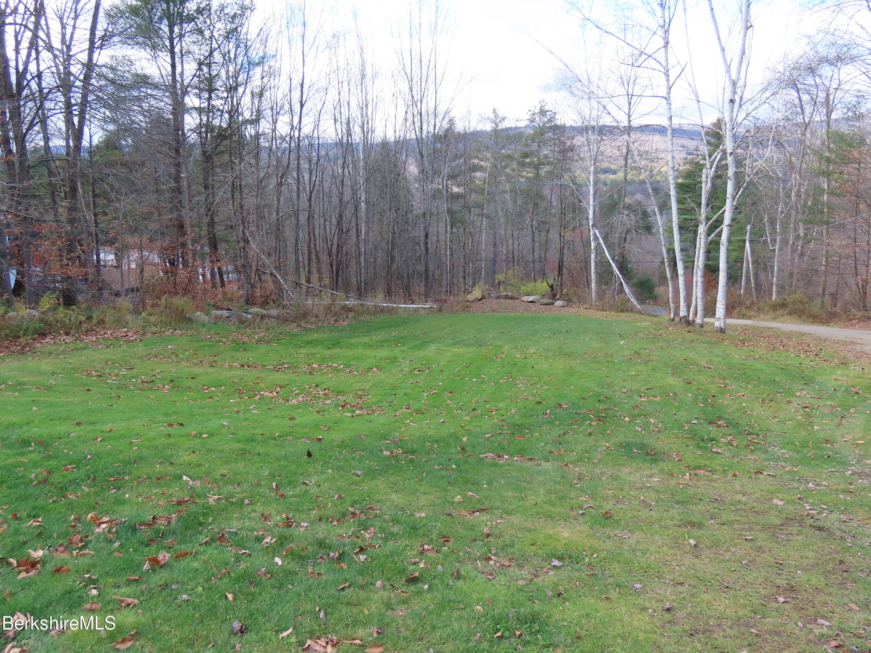 864 E Road Stamford, VT 05352 - Photo 3 of 33 a backyard of a house with lots of green space