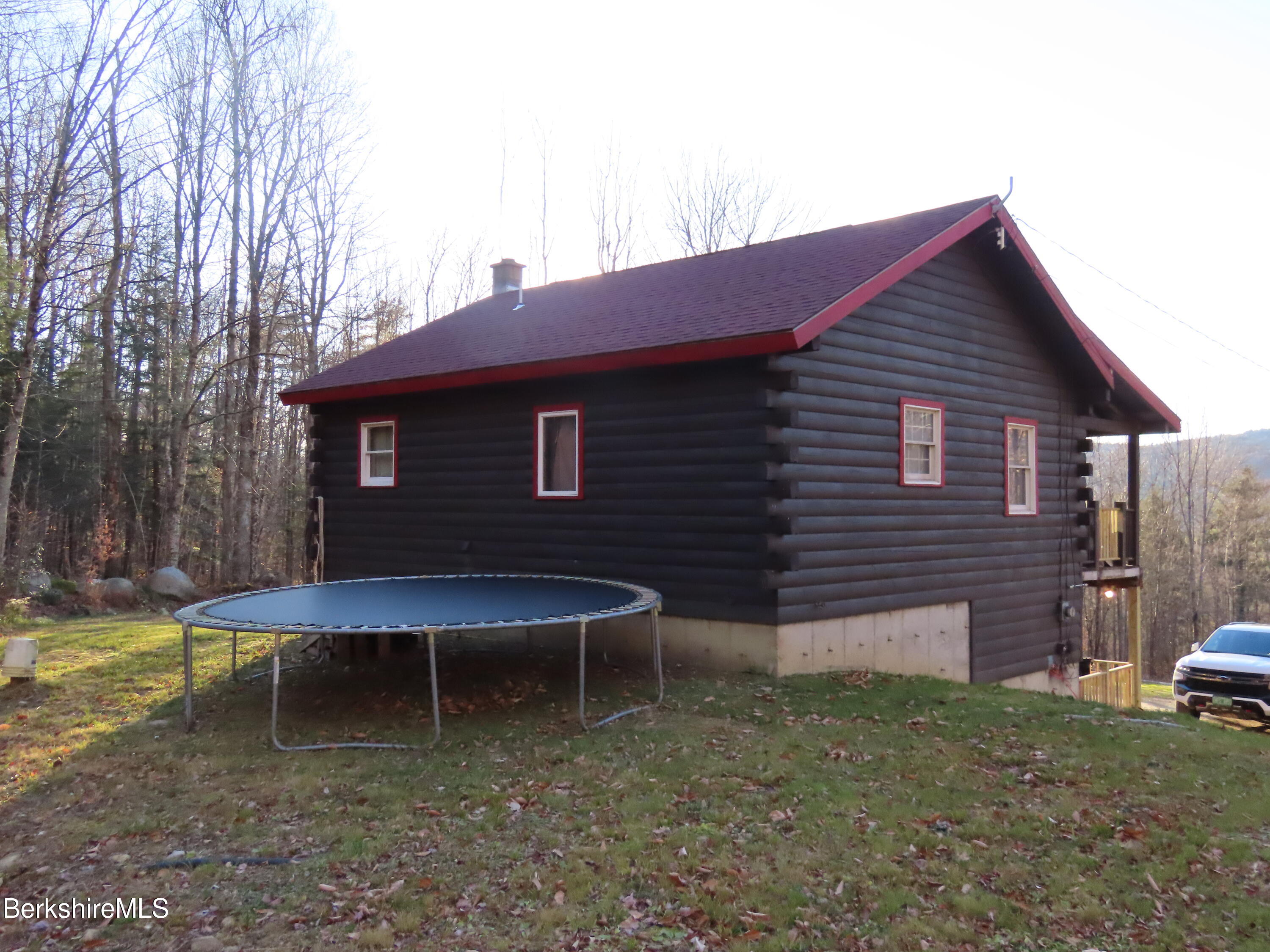 864 E Road Stamford, VT 05352 - Photo 7 of 33 a backyard of a house with table and chairs
