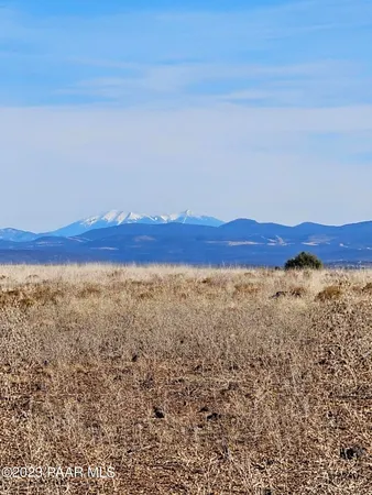 a view of ocean and mountains