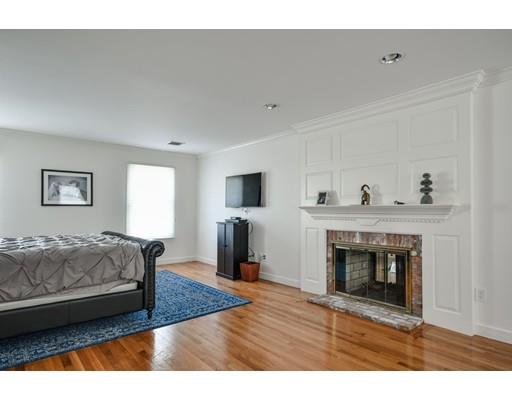 73 Pheasant Landing Road Needham, MA 02492 - Photo 15 of 23 a living room with furniture and a fireplace