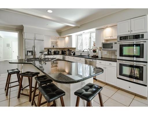 73 Pheasant Landing Road Needham, MA 02492 - Photo 8 of 23 a kitchen with stainless steel appliances granite countertop a stove a sink dishwasher a microwave oven with granite countertops and cabinets