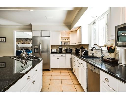 73 Pheasant Landing Road Needham, MA 02492 - Photo 10 of 23 a kitchen with stainless steel appliances granite countertop a stove a sink dishwasher a refrigerator and white cabinets with wooden floor