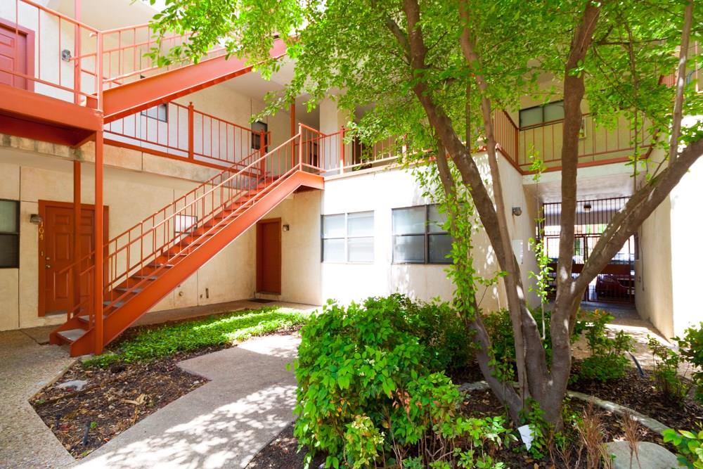 706 West 22nd Street, Unit 307 Austin, TX 78705 - Photo 15 of 20 a view of a house with a yard