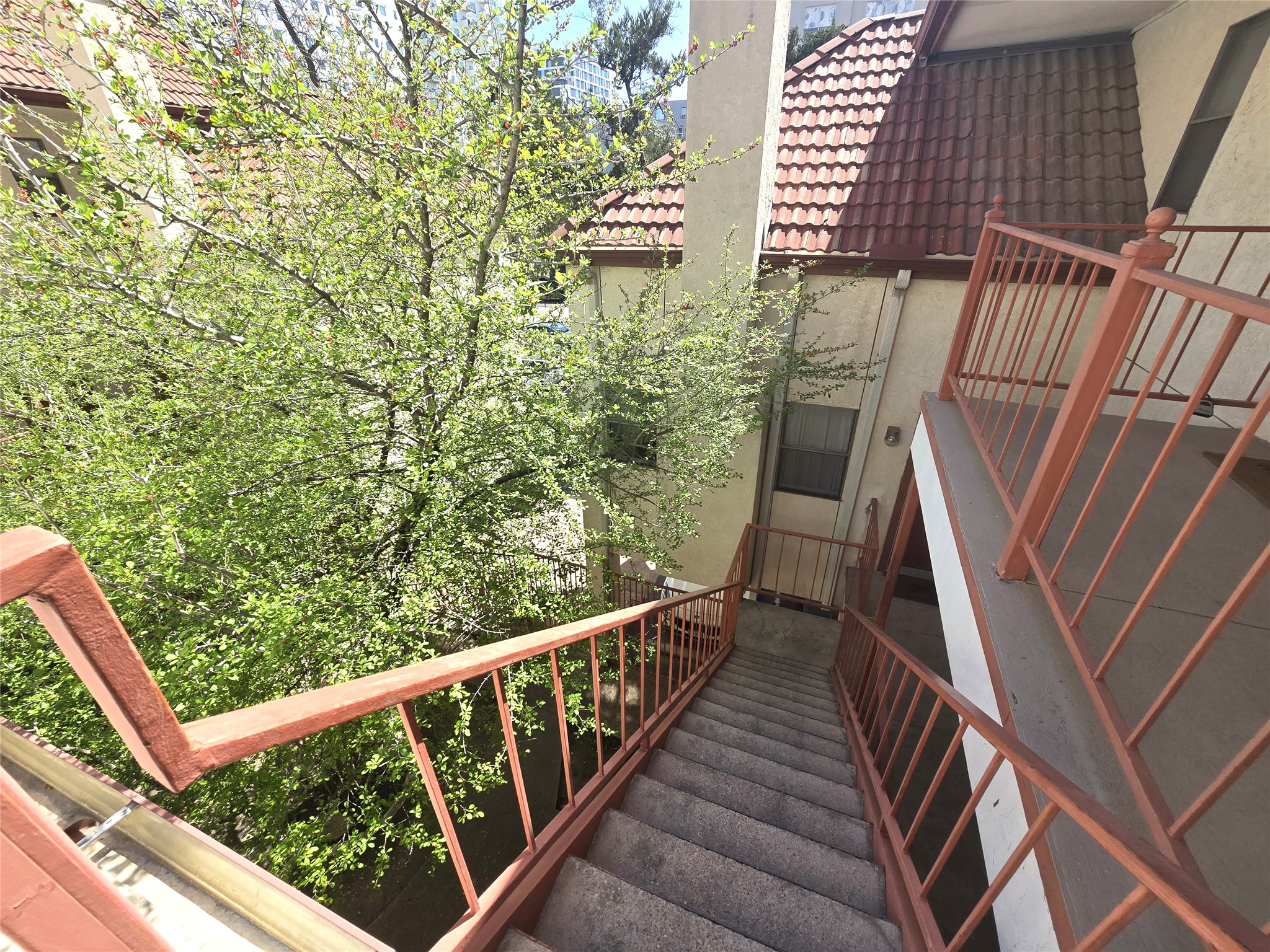 706 West 22nd Street, Unit 307 Austin, TX 78705 - Photo 17 of 20 a view of balcony with wooden floor and fence