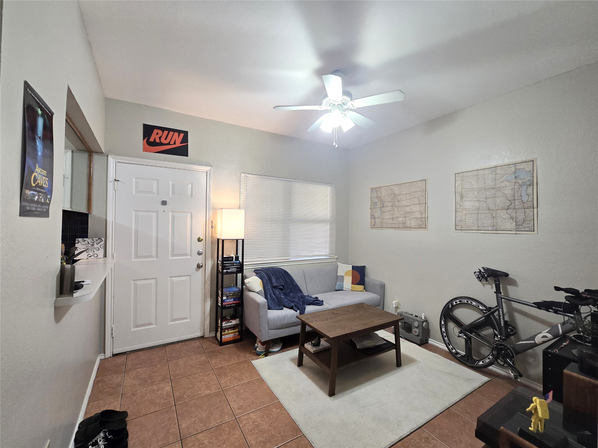 706 West 22nd Street, Unit 307 Austin, TX 78705 - Photo 2 of 20 a living room with furniture a flat screen tv and gym equipment