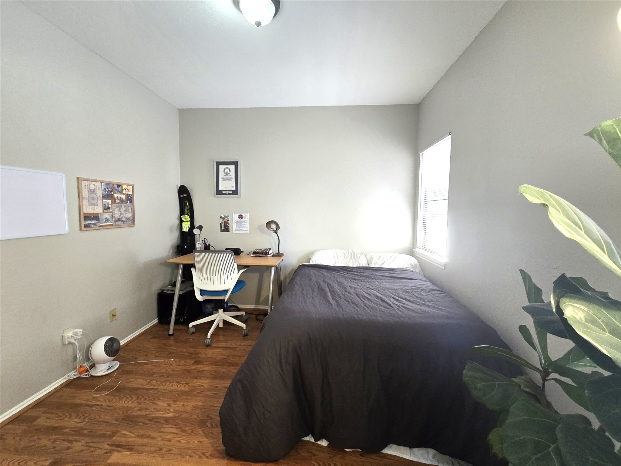 706 West 22nd Street, Unit 307 Austin, TX 78705 - Photo 6 of 20 a bedroom with a bed and a window