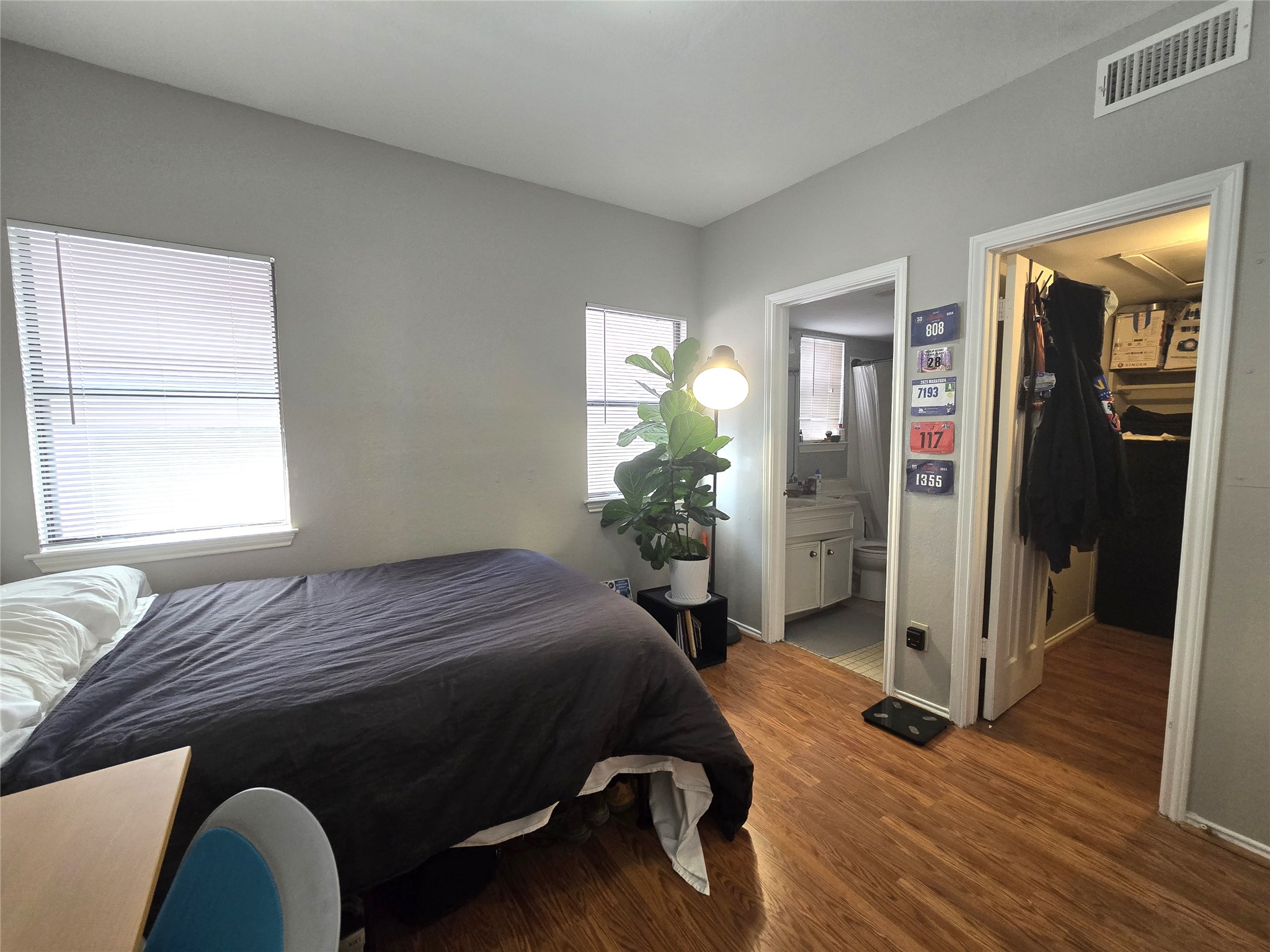 706 West 22nd Street, Unit 307 Austin, TX 78705 - Photo 7 of 20 a bedroom with a bed and a window