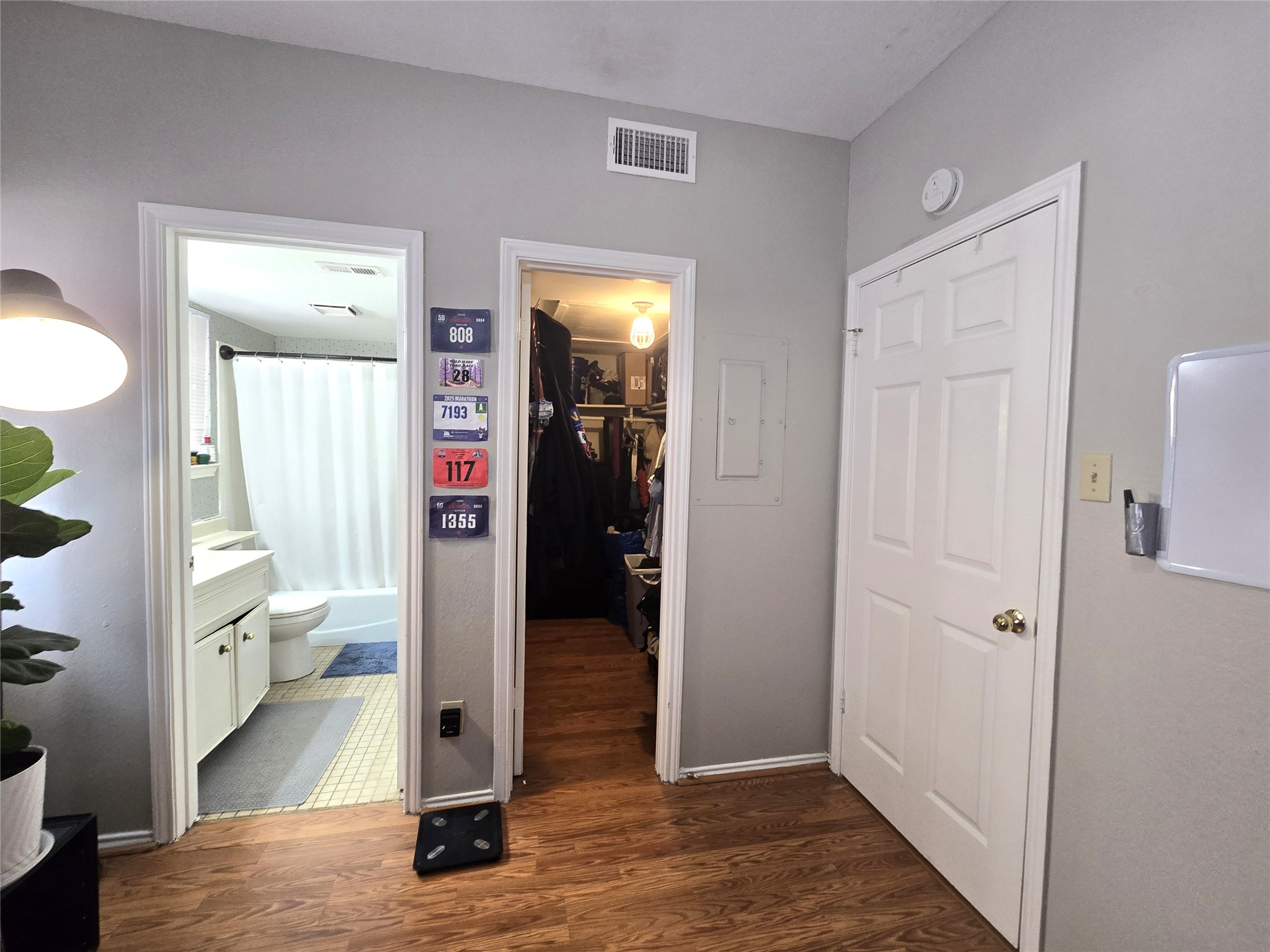 706 West 22nd Street, Unit 307 Austin, TX 78705 - Photo 8 of 20 a view of a hallway with bathroom and wooden floor