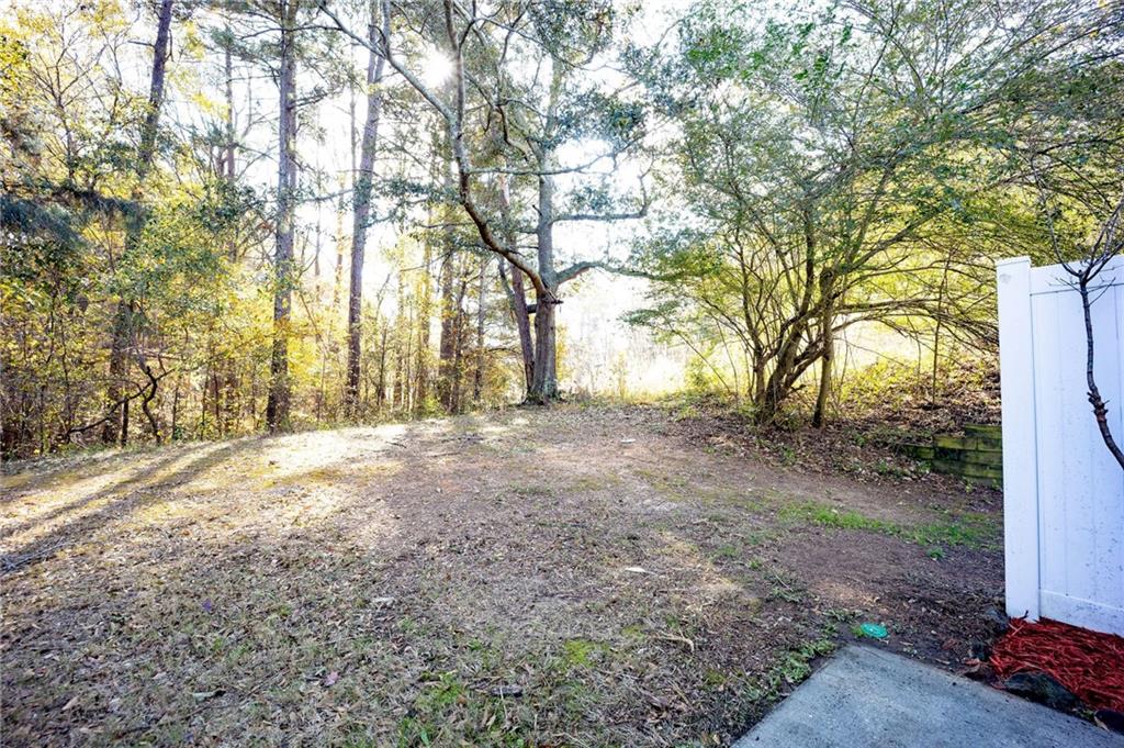 1468 Box Circle Winder, GA 30680 - Photo 12 of 33 a view of dirt yard with a tree