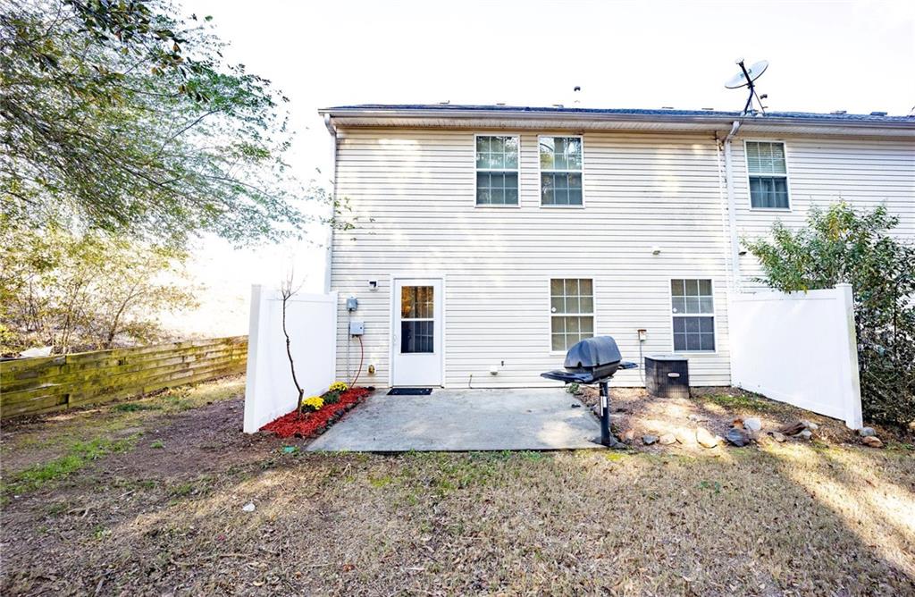 1468 Box Circle Winder, GA 30680 - Photo 14 of 33 a backyard of a house with barbeque oven table and chairs