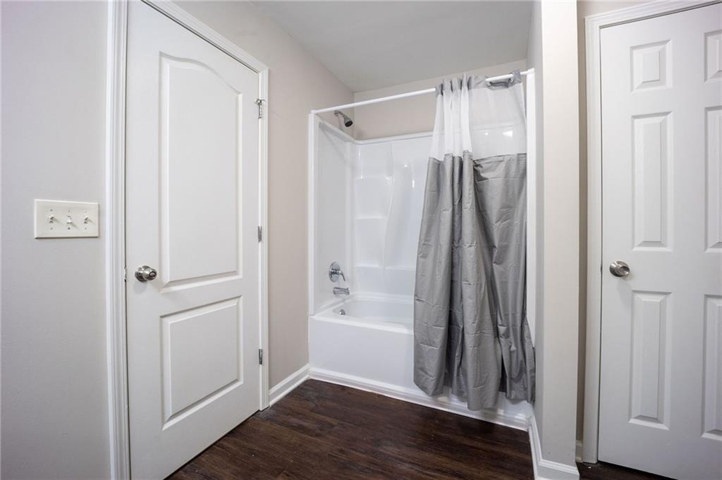 1468 Box Circle Winder, GA 30680 - Photo 18 of 33 a bathroom with a bathtub and a glass door