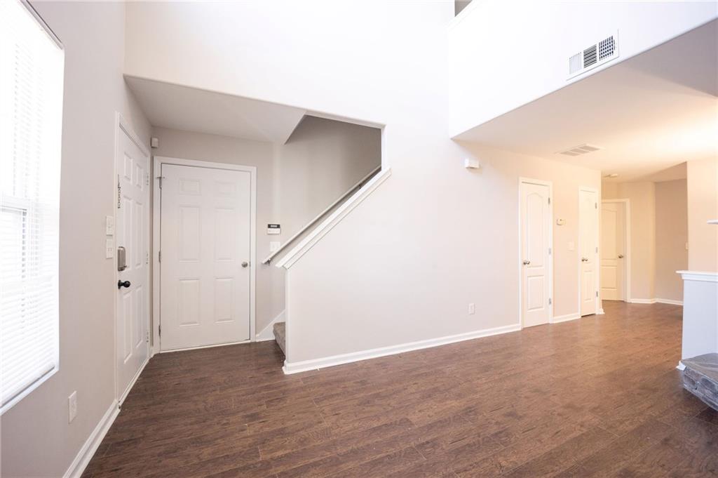 1468 Box Circle Winder, GA 30680 - Photo 5 of 33 a view of an empty room with wooden floor
