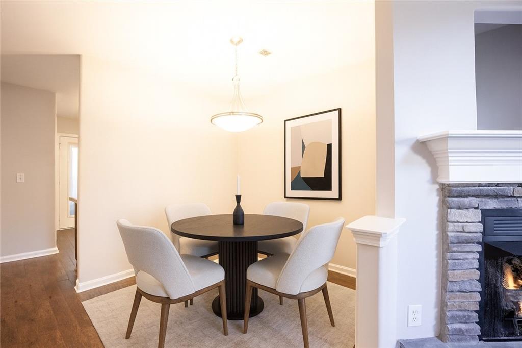 1468 Box Circle Winder, GA 30680 - Photo 7 of 33 a view of a dining room with furniture and wooden floor