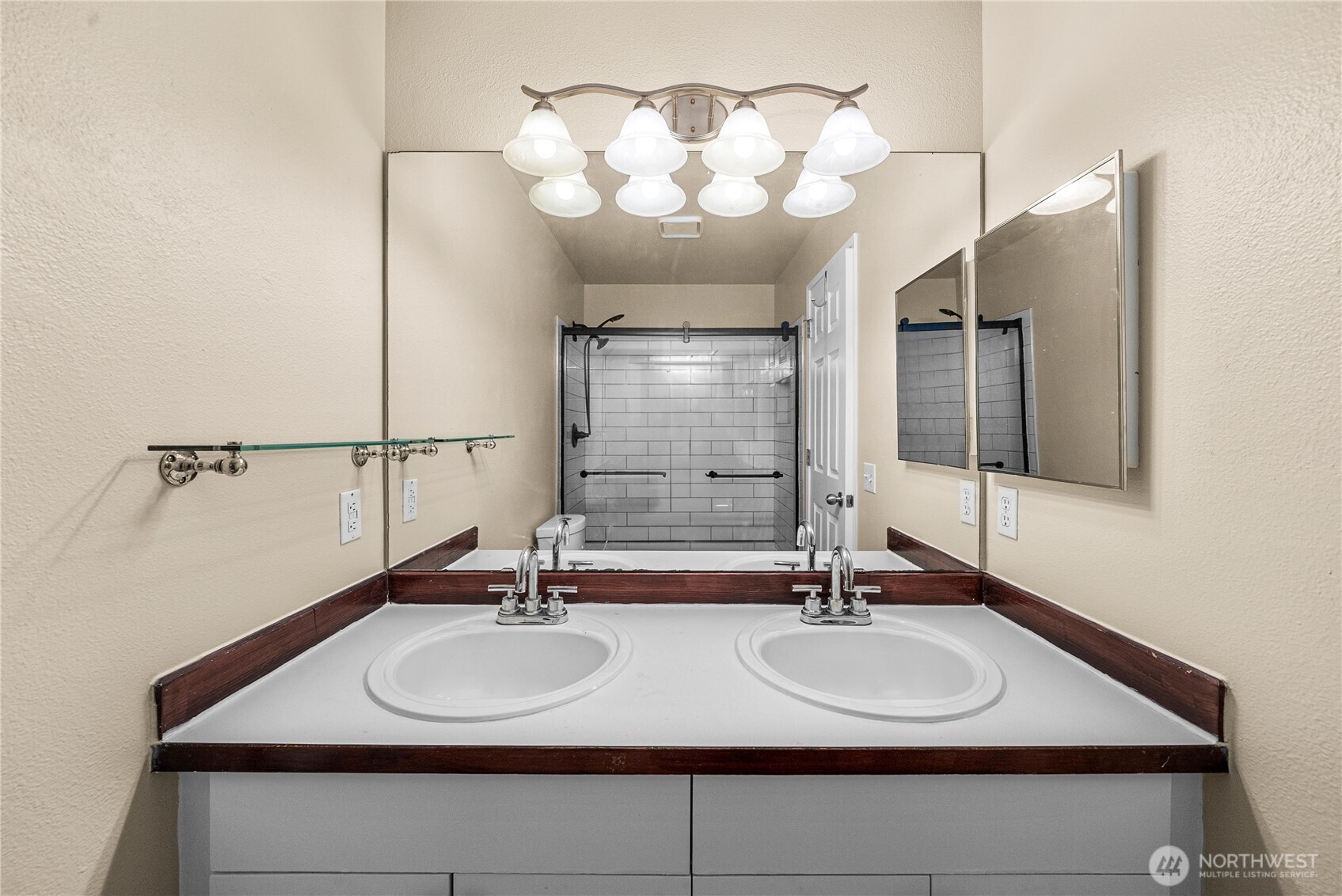 24501 234th Way Southeast Maple Valley, WA 98038 - Photo 30 of 34 a bathroom with a sink and a mirror
