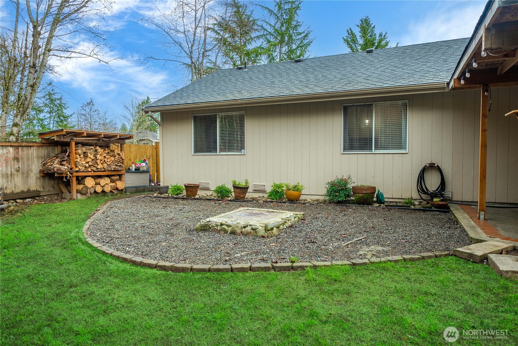 24501 234th Way Southeast Maple Valley, WA 98038 - Photo 10 of 34 a view of a backyard with a sitting area